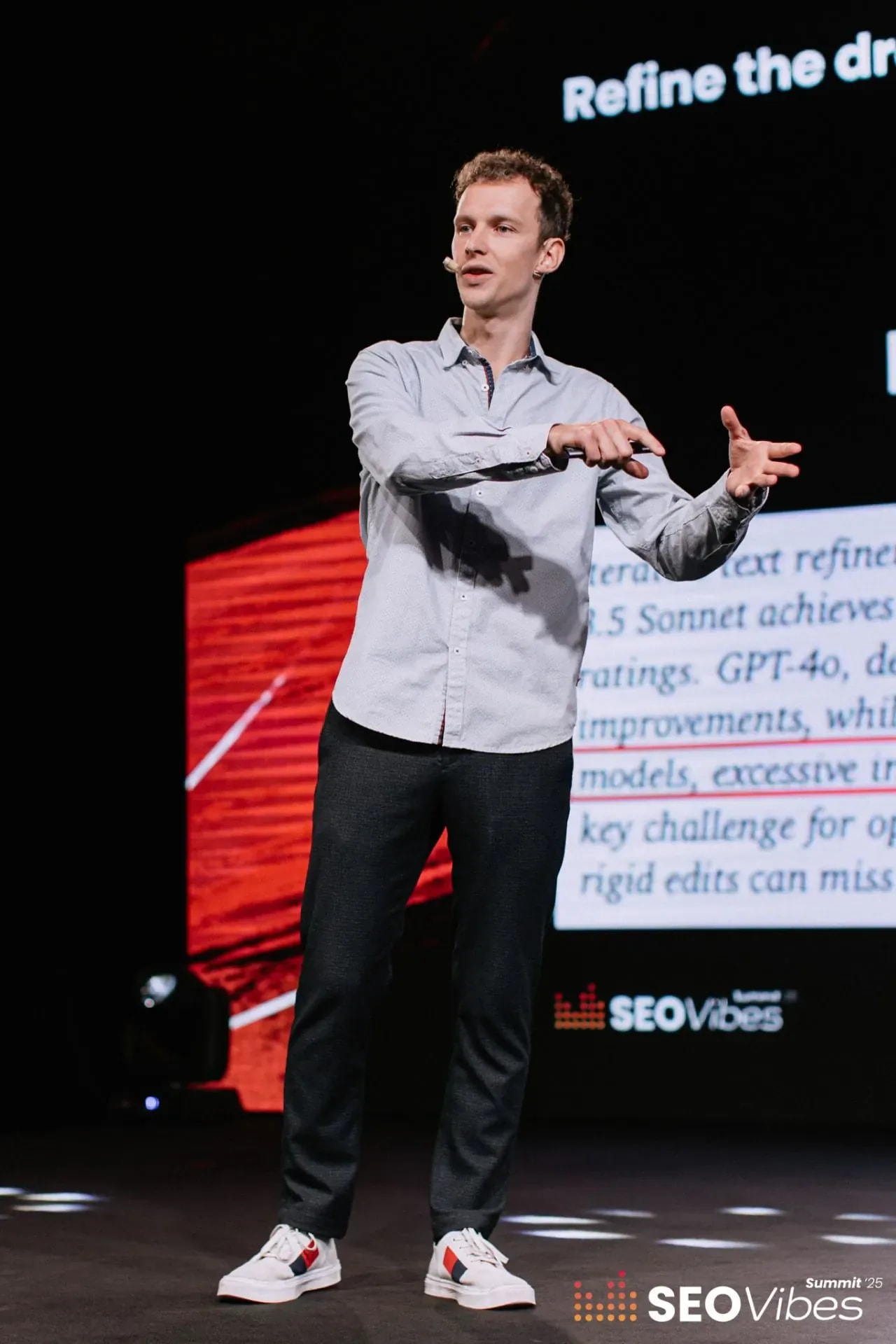 Pavel Klimakov presenting on stage at SEO Vibes Summit
